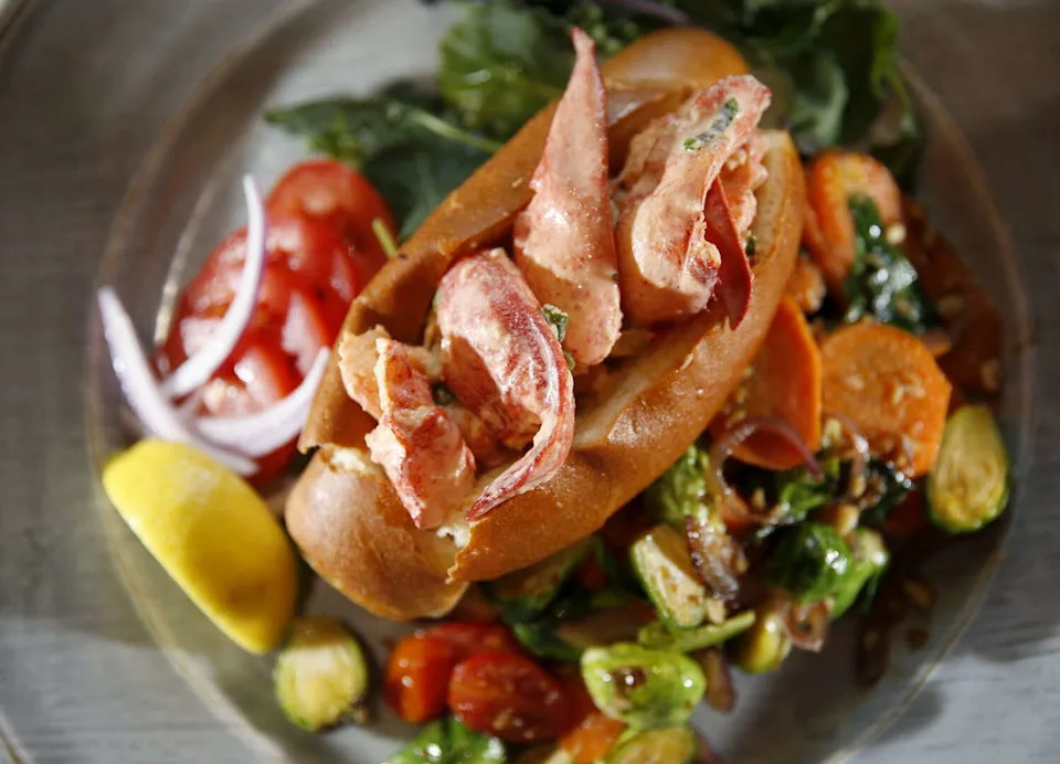 Rex's Seafood in the Dallas Farmers Market shop serves lobster rolls (pictured), oysters and more. (DMN file)