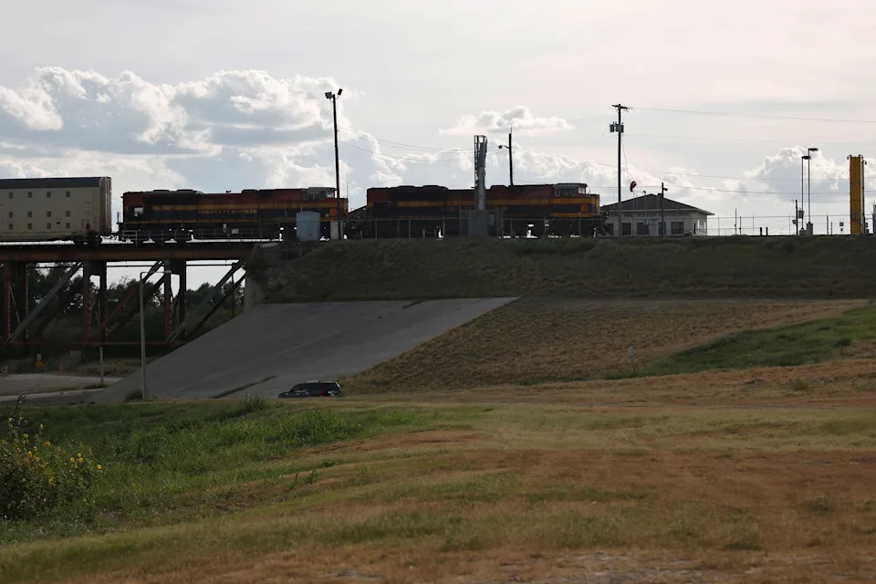 A cargo train coming from Mexico is seen crossing the border into the U.S., as seen from Laredo, Texas, U.S. June 2, 2019. REUTERS/Carlos Jasso