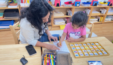 teacher working with student