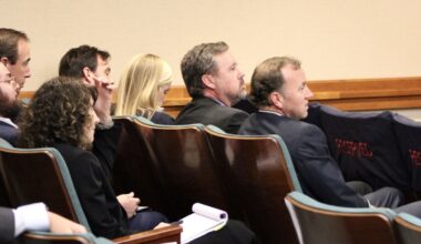 Members of the Eastland family, which runs Camp Mystic, and their legal counsel listen to testimony during an April 28 hearing at the Texas Capitol. (Hannah Norton/Community Impact)