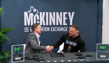 Michael Kowski, president and CEO of the McKinney Economic Development Corp. (left) shakes hands with The Andy App Founder Michael Reeves.