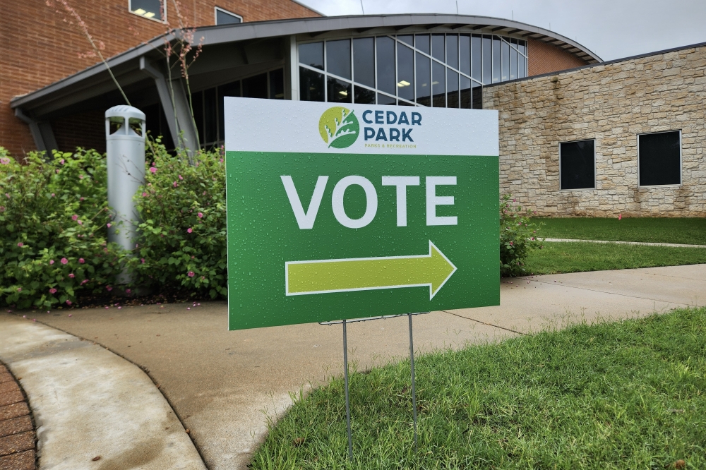 A sign directs voters to the polls at the Cedar Park Recreation Center. 15 proposed charter amendments were on the ballot May 2. (Daniel Schwalm/Community Impact)
