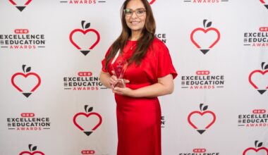 Ruth Peña, the principal of Houston ISD's Charles H. Milby High School, posing with a trophy at the 2026 H-E-B Excellence in Education Awards