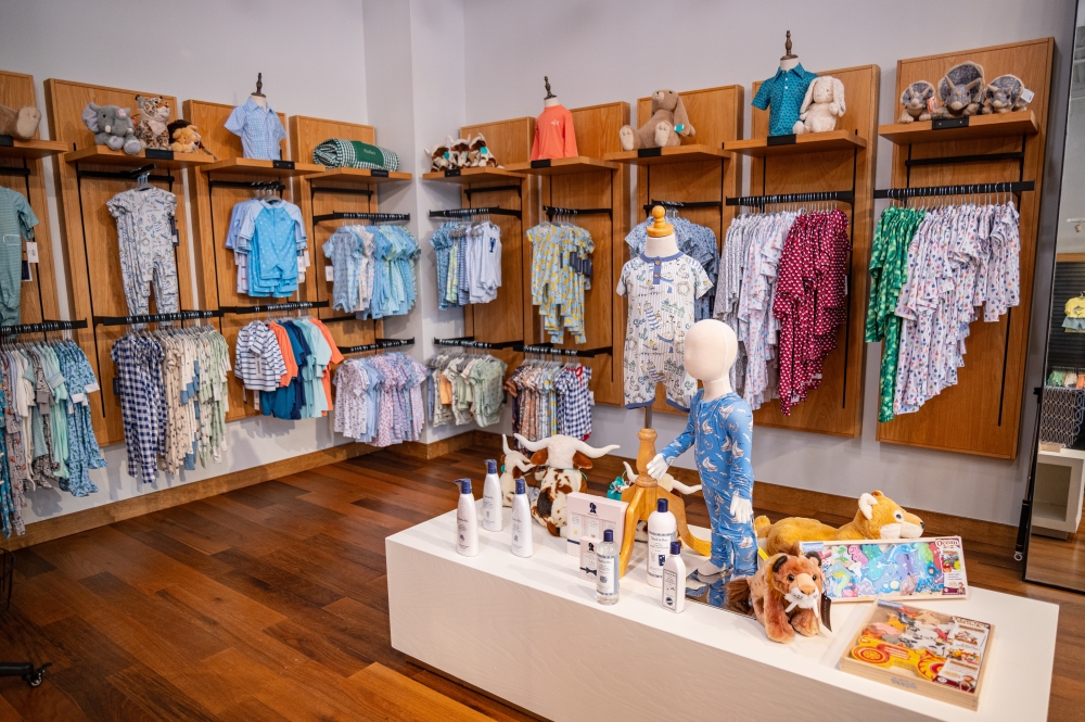 The 3,012-square foot location features a plush play area with toys, a space for private shopping events and group happy hours as well as a large dining table for in-store baby showers. (Courtesy Brandon Holmes)