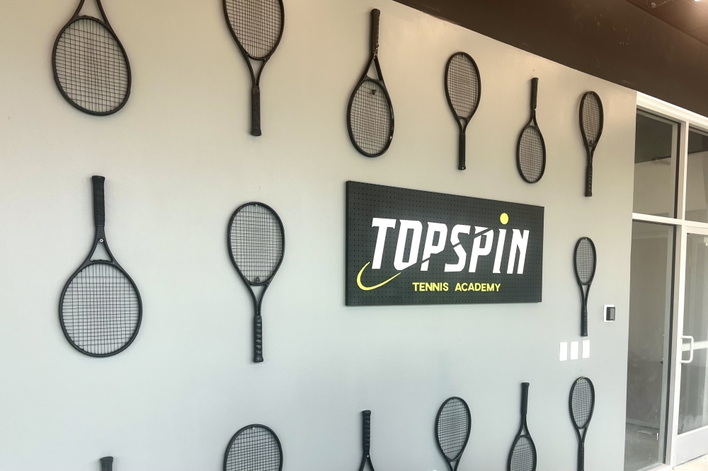 TopSpin Tennis Academy will feature two full-sized indoor tennis courts, four indoor red courts and a pickleball court, a full restroom with showers, a small cafe, and a full pro shop offering gear, athletic clothing, and stringing services. (Haley McLeod/Community Impact)