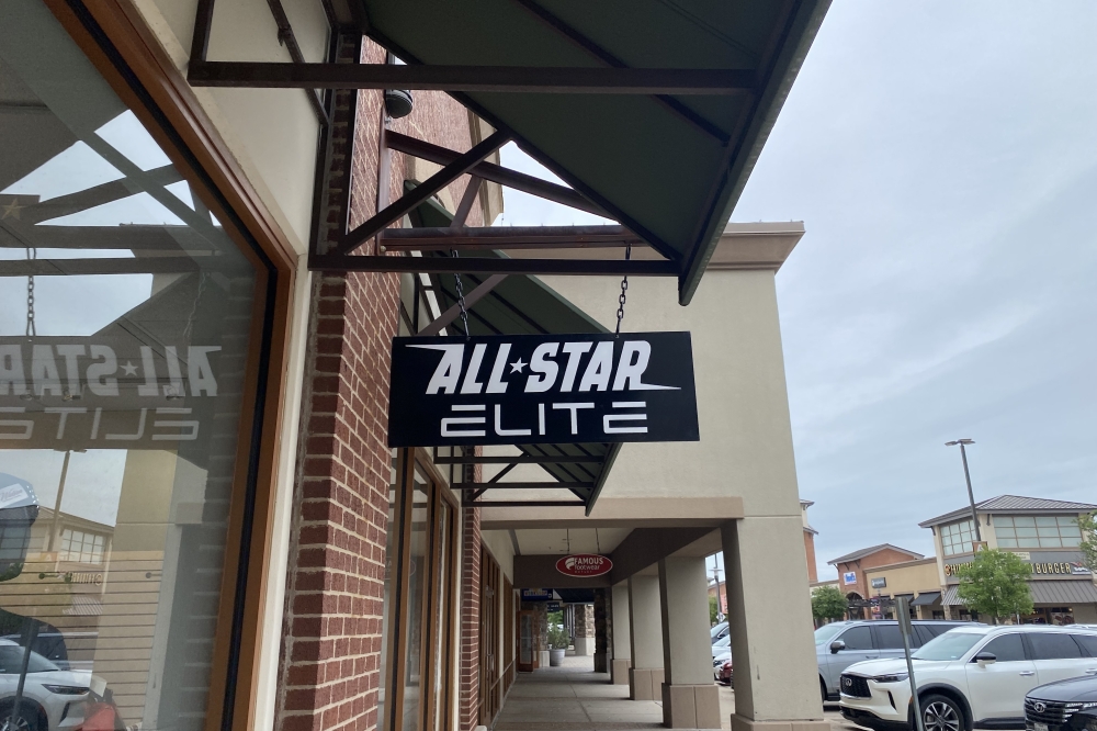 a sign outside of a store that reads "All Star Elite"