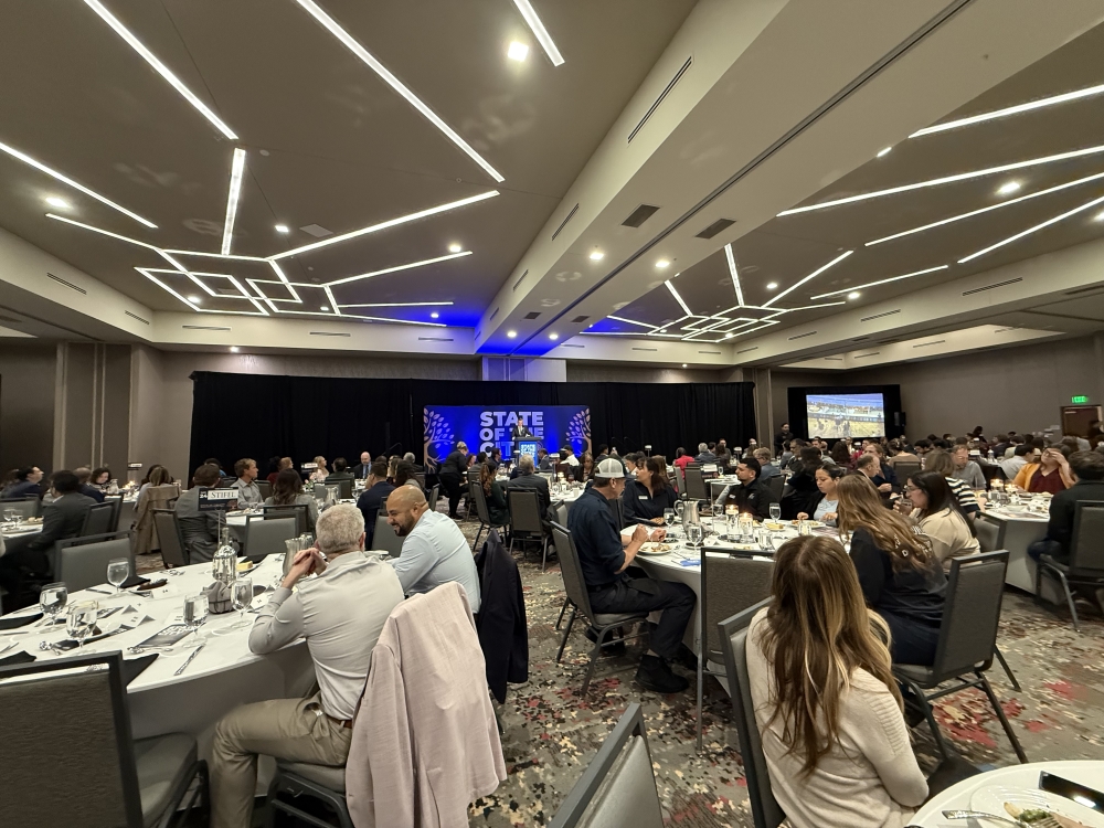 Pflugerville mayor Doug Weiss speaks at the May 7 State of City luncheon at the Courtyard by Marriott. (Grant Crawford/Community Impact)