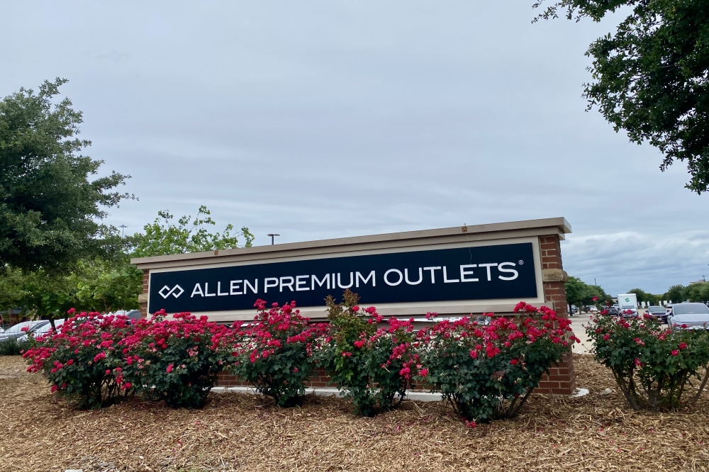 a sign for the Allen Premium Outlets