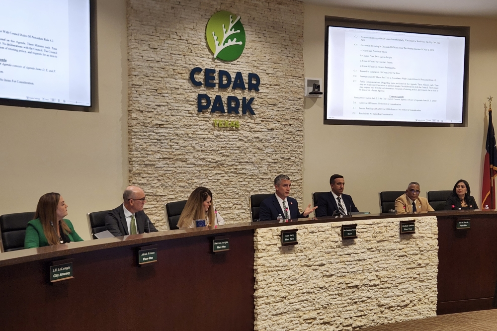 Cedar Park Mayor Jim Penniman-Morin and new council members Darron Jurajda, Michael Endres and Shweta Padmanabha took oath of office May 14. (Daniel Schwalm/Community Impact)