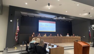 DSISD Chief Communications Officer Jennifer Edwards (left, center) presented the High School No. 2 Naming and Branding Committee's recommendations to the board of trustees May 18. (Sienna Wight/Community Impact)