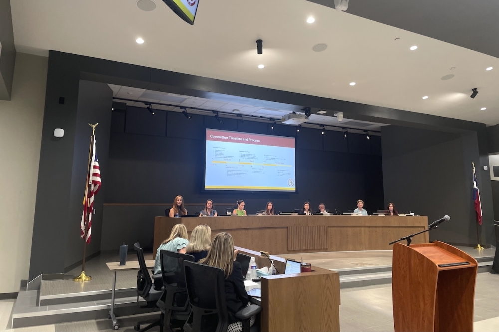 DSISD Chief Communications Officer Jennifer Edwards (left, center) presented the High School No. 2 Naming and Branding Committee's recommendations to the board of trustees May 18. (Sienna Wight/Community Impact)