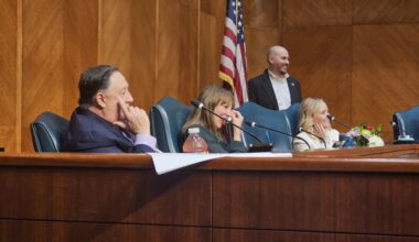 District C council member Abbie Kamin wipes tears from her eyes as she listens to council members share memories with her on her final day at City Council. (Ariel Worthy/Community Impact)