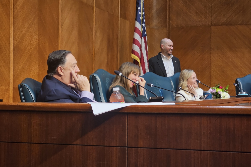 District C council member Abbie Kamin wipes tears from her eyes as she listens to council members share memories with her on her final day at City Council. (Ariel Worthy/Community Impact)