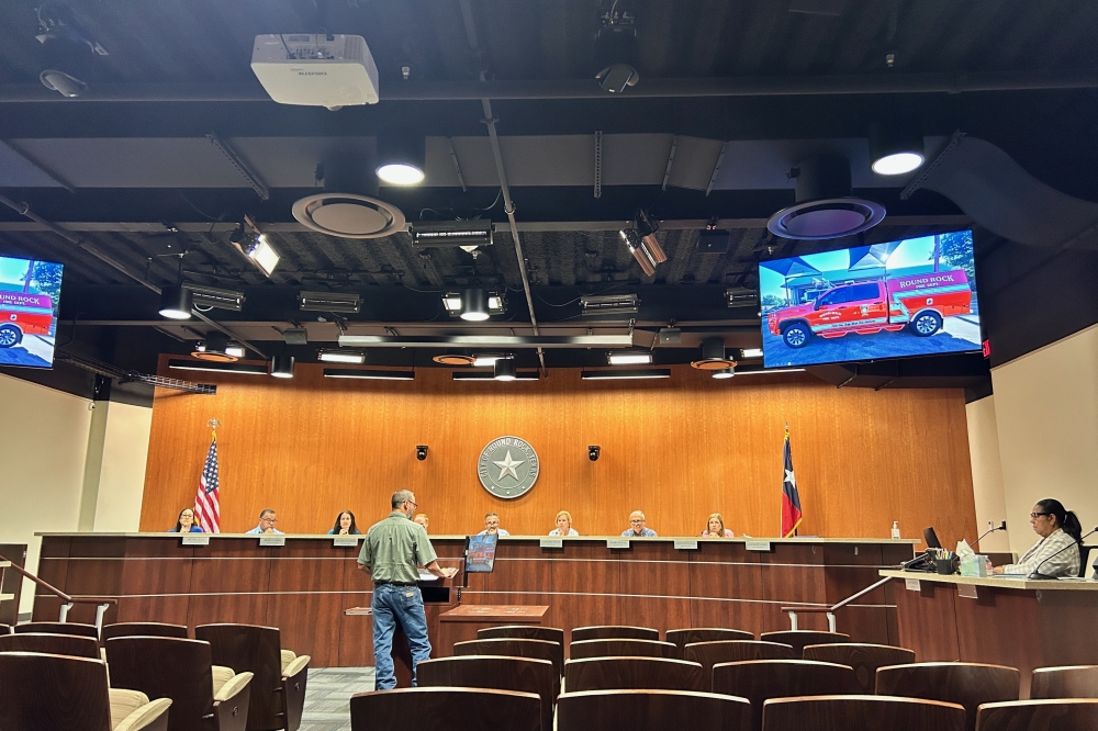 General Services Department Director Corey Amidon presents information about the proposed vehicle purchase at a May 12 packet briefing. (Brooke Sjoberg/Community Impact)