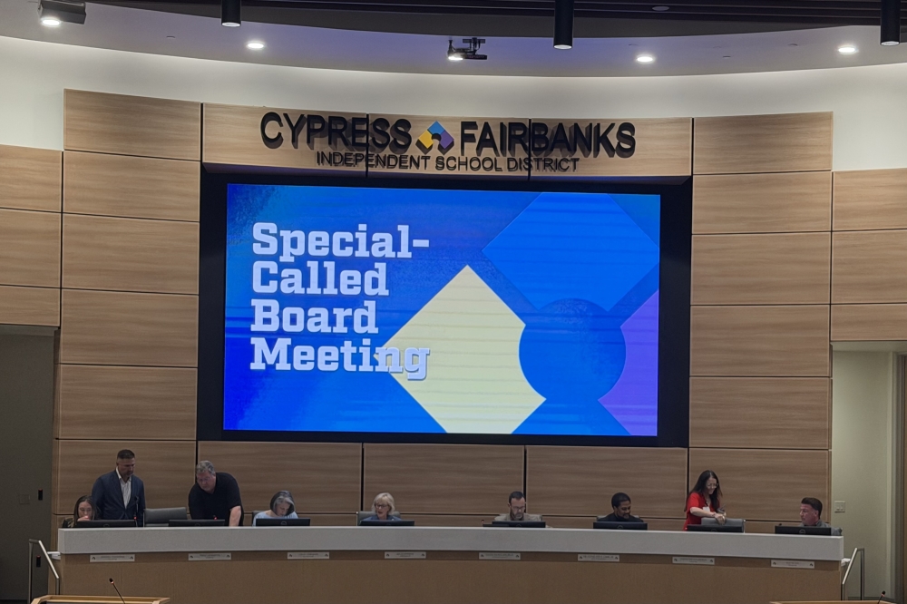 CFISD board of trustees and superintendent sit at the dais, with the screen behind them reading "Special-called board meeting"