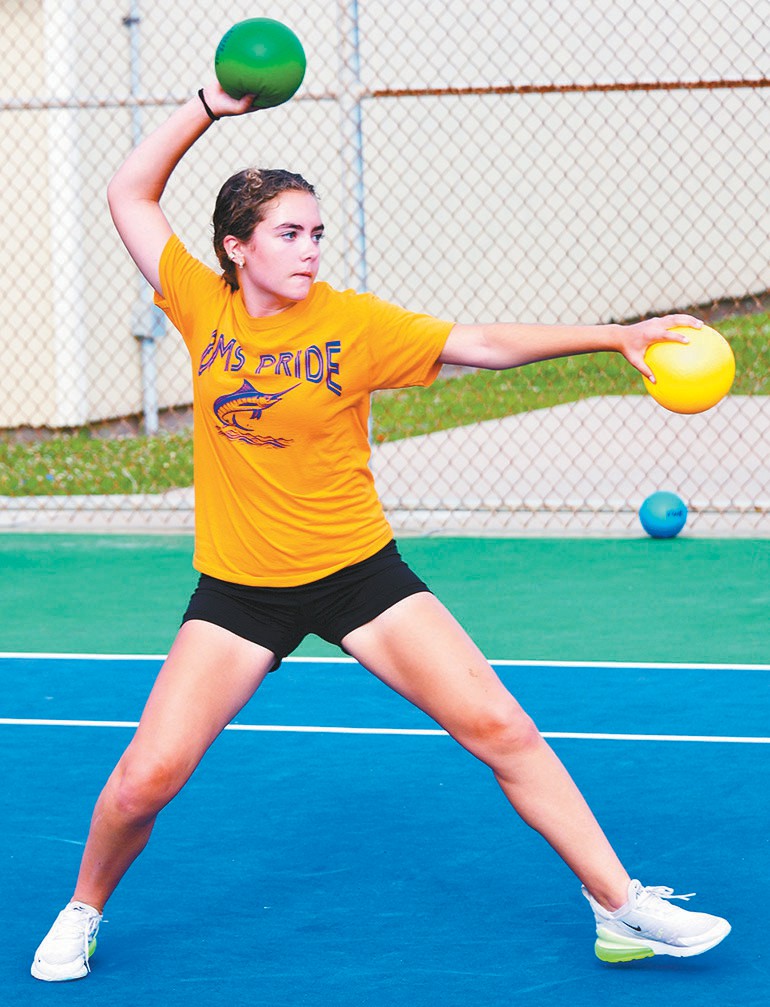 Brundrett Middle School seventh grader Cora Dirk gets ready to throw a ball during a dodgeball game.
