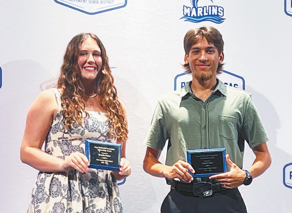 McDonald Award recipients Port Aransas High School graduates Brooke Jones, left, and Daniel Ruiz celebrate receiving the Jerry McDonald Award good citizen award during the Port Aransas High School Scholarship Ceremony at the Cole Center on Thursday, May 14. The award is named after McDonald, the only Port Aransas resident to be killed in action in Vietnam. He was posthumously awarded the Bronze Star Medal for heroism and a Purple Heart. Staff photo by Jimmy Willden