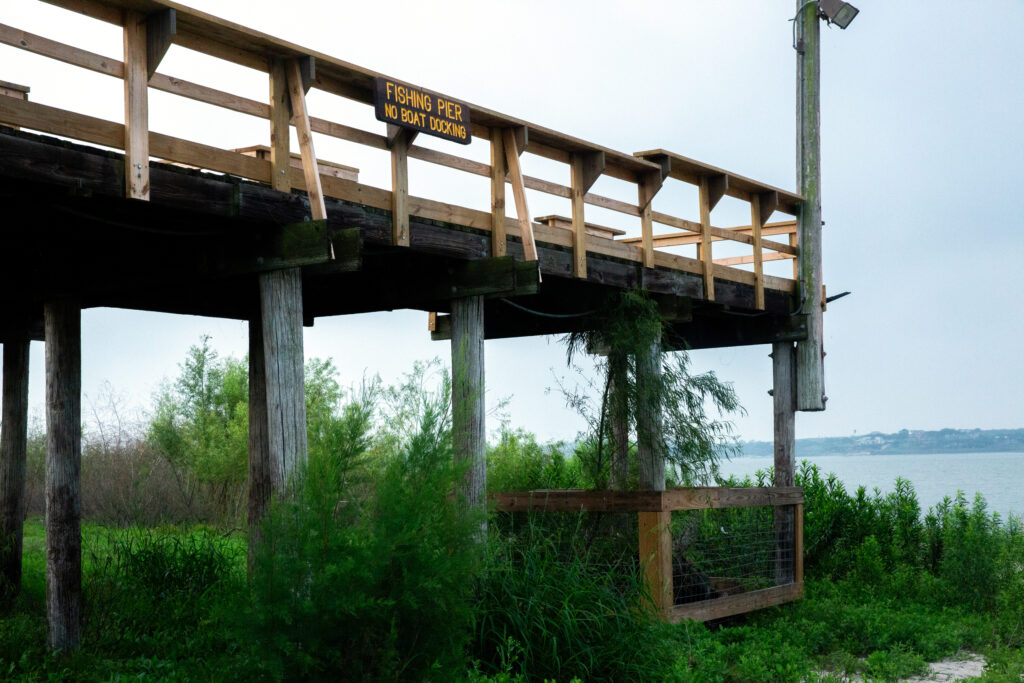Water sits 30 or more feet below the base of a fishing pier at Lake Corpus Christi on April 28. Credit: Dylan Baddour/Inside Climate News