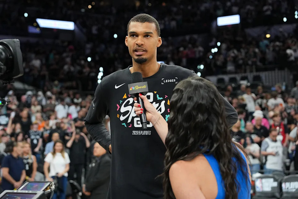 May 24, 2026; San Antonio, Texas, USA; San Antonio Spurs center Victor Wembanyama (1) speaks with Peacock sideline reporter Ashley ShahAhmadi after game four of the western conference finals for the 2026 NBA playoffs against the Oklahoma City Thunder at Frost Bank Center. Mandatory Credit: Daniel Dunn-Imagn Images