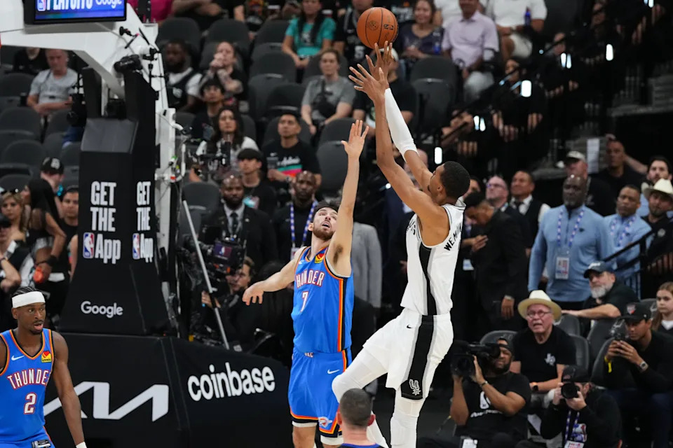 May 24, 2026; San Antonio, Texas, USA; San Antonio Spurs center Victor Wembanyama (1) shoots while defended by Oklahoma City Thunder center Chet Holmgren (7) in the second quarter during game four of the western conference finals for the 2026 NBA playoffs at Frost Bank Center. Mandatory Credit: Scott Wachter-Imagn Images