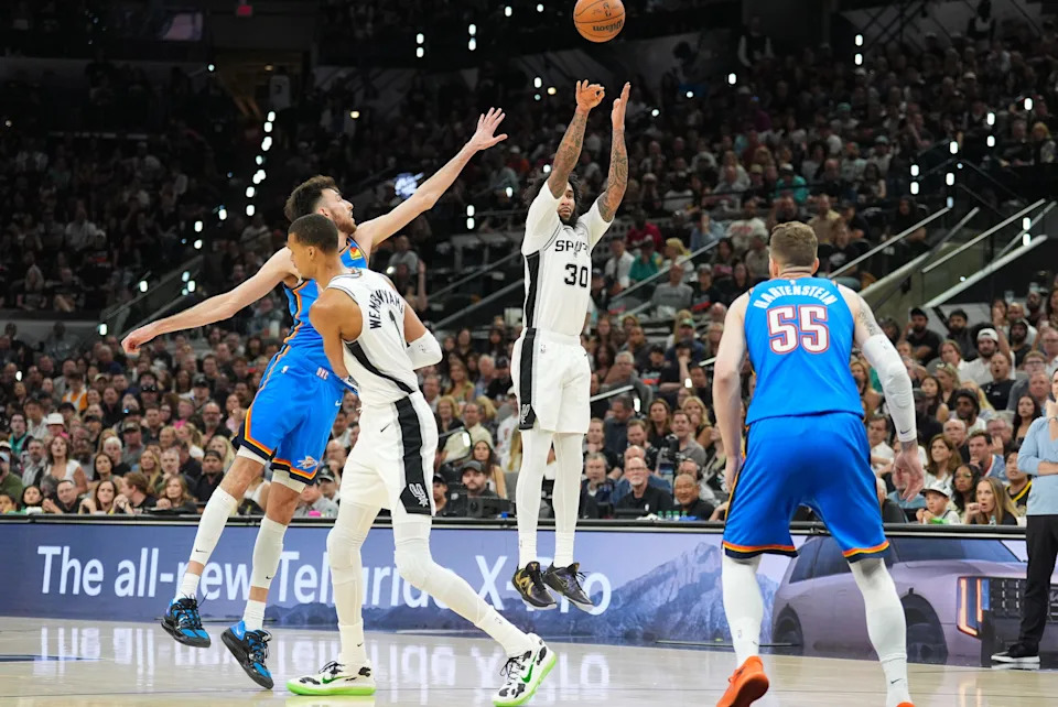 May 24, 2026; San Antonio, Texas, USA; San Antonio Spurs forward Julian Champagnie (30) shoots in the first quarter against the Oklahoma City Thunder during game four of the western conference finals for the 2026 NBA playoffs at Frost Bank Center. Mandatory Credit: Daniel Dunn-Imagn Images