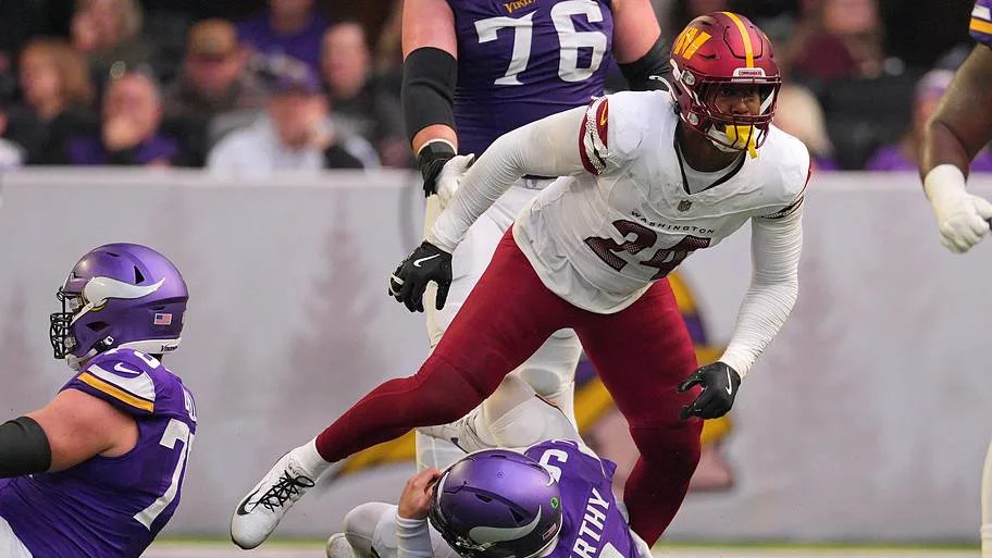 Dec 7, 2025; Minneapolis, Minnesota, USA; Washington Commanders outside linebacker Von Miller (24) sacks Minnesota Vikings qu