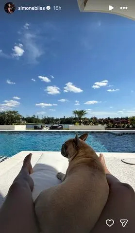 Simone Biles relaxes by the pool with her dog at her custom-built Texas mansion.Credit: Simone Biles/Instagram