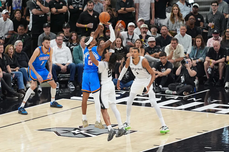 May 24, 2026; San Antonio, Texas, USA; Oklahoma City Thunder guard Shai Gilgeous-Alexander (2) shoots while defended by San Antonio Spurs guard Stephon Castle (5) in the second quarter during game four of the western conference finals for the 2026 NBA playoffs at Frost Bank Center. Mandatory Credit: Daniel Dunn-Imagn Images