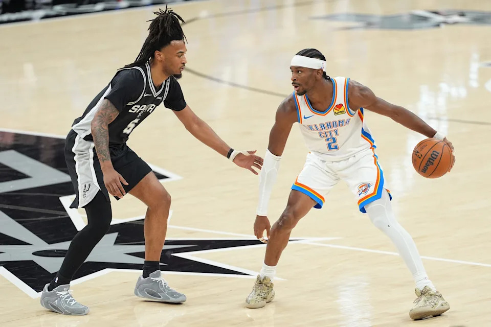 May 28, 2026; San Antonio, Texas, USA; Oklahoma City Thunder guard Shai Gilgeous-Alexander (2) dribbles the ball against San Antonio Spurs guard Stephon Castle (5) in the first half during game six of the western conference finals for the 2026 NBA playoffs at Frost Bank Center. Mandatory Credit: Daniel Dunn-Imagn Images
