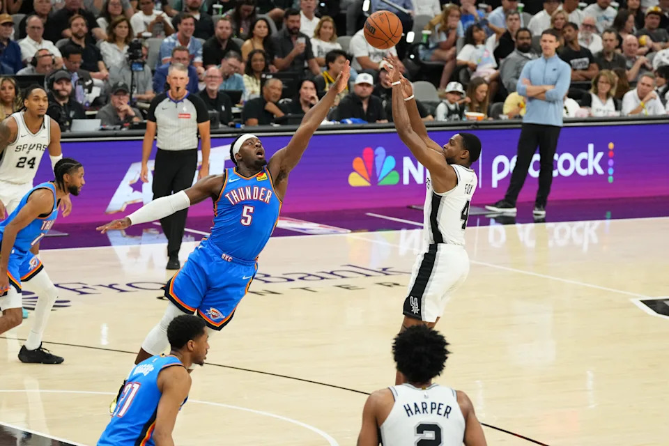 May 24, 2026; San Antonio, Texas, USA; San Antonio Spurs guard De'Aaron Fox (4) shoots the ball in the fourth quarter against the Oklahoma City Thunder during game four of the western conference finals for the 2026 NBA playoffs at Frost Bank Center. Mandatory Credit: Scott Wachter-Imagn Images