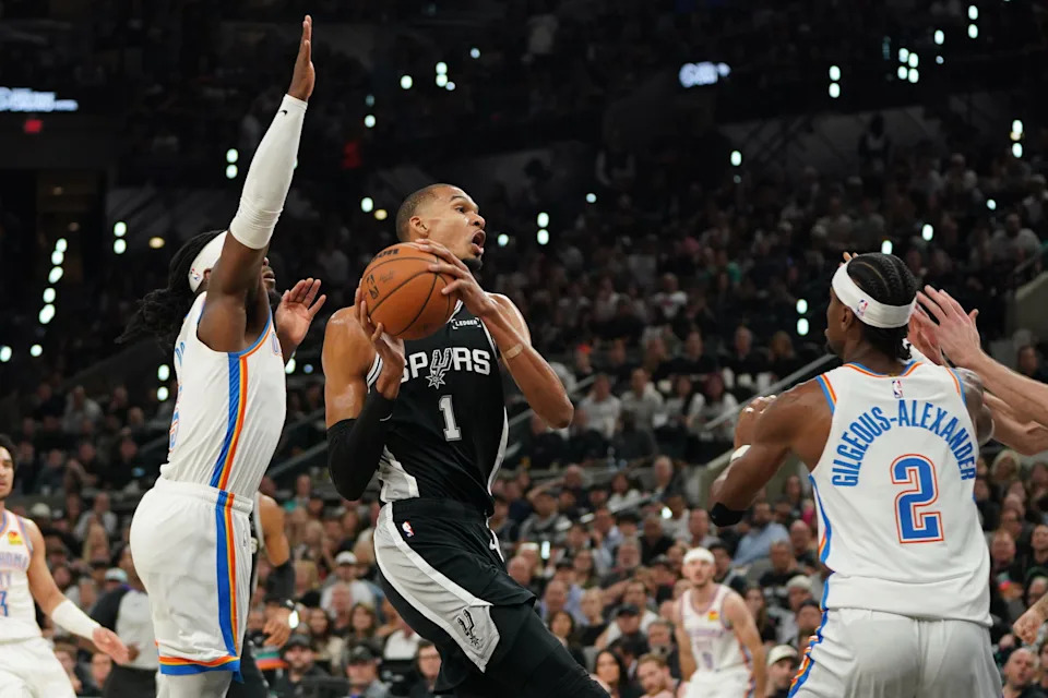 May 28, 2026; San Antonio, Texas, USA; San Antonio Spurs forward Victor Wembanyama (1) goes in for a shot against Oklahoma City Thunder guard Shai Gilgeous-Alexander (2) in the first half during game six of the western conference finals for the 2026 NBA playoffs at Frost Bank Center. Mandatory Credit: Dustin Safranek-Imagn Images