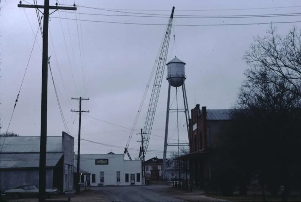 A water tower and crane are seen in Gruene, Texas on February 8, 1976. (Courtesy of Texas Historical Commission, Courtesy Of Texas Historical Commission)