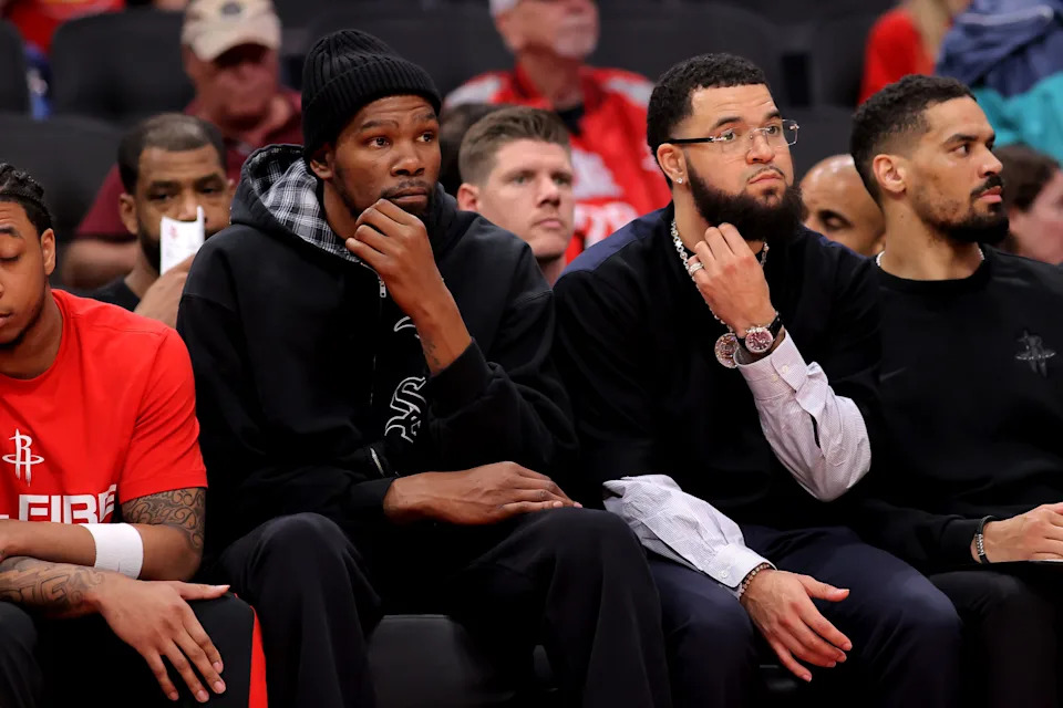 Rockets players Kevin Durant, left, and Fred VanVleet sit on the bench during the fourth quarter of Game 6 of their playoff series against the Lakers at Toyota Center in Houston on May 1, 2026.
