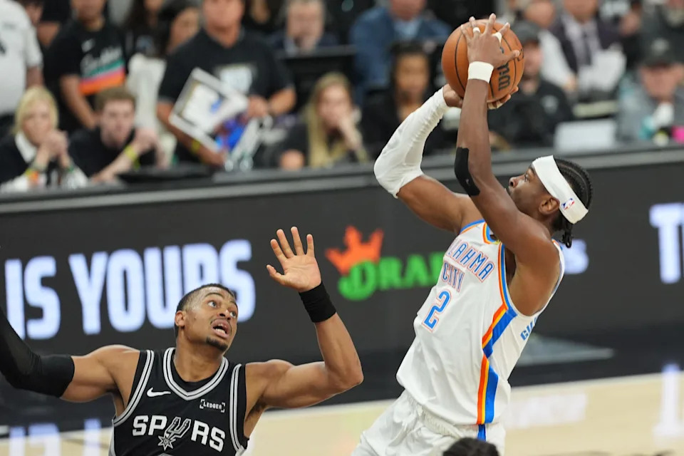May 28, 2026; San Antonio, Texas, USA; Oklahoma City Thunder guard Shai Gilgeous-Alexander (2) shoots the ball past San Antonio Spurs forward Keldon Johnson (3) in the first half during game six of the western conference finals for the 2026 NBA playoffs at Frost Bank Center. Mandatory Credit: Daniel Dunn-Imagn Images