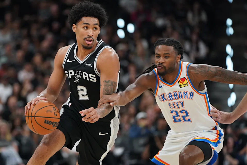 May 28, 2026; San Antonio, Texas, USA; San Antonio Spurs guard Dylan Harper (2) dribbles the ball past Oklahoma City Thunder guard Cason Wallace (22) in the first half during game six of the western conference finals for the 2026 NBA playoffs at Frost Bank Center. Mandatory Credit: Dustin Safranek-Imagn Images