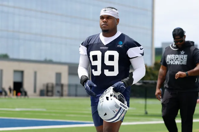 May 1, 2026; Frisco, TX, USA; Dallas Cowboys defensive end LT Overton (99) walks off the field after practice at the Ford Center at the Star Training Facility in Frisco, Texas. Mandatory Credit: Chris Jones-Imagn Images
