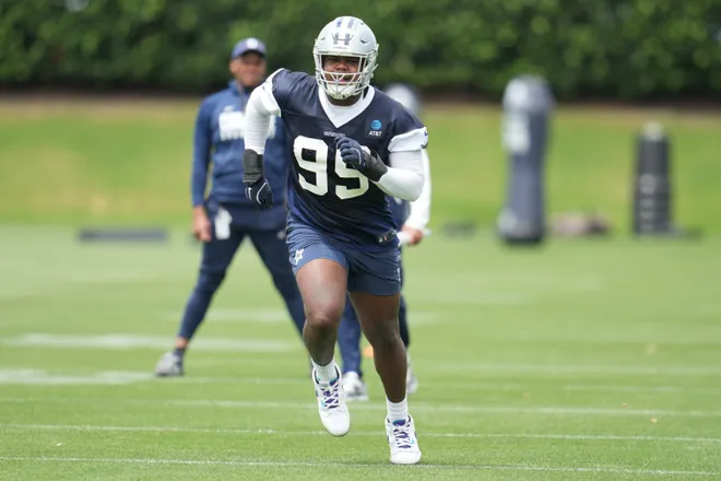 May 1, 2026; Frisco, TX, USA; Dallas Cowboys defensive tackle Tommy Dunn (95) goes through a drill during practice at the Ford Center at the Star Training Facility in Frisco, Texas. Mandatory Credit: Chris Jones-Imagn Images