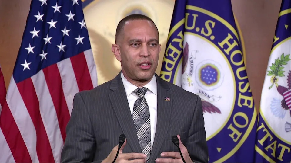 House Minority Leader Hakeem Jeffries speaking at a podium