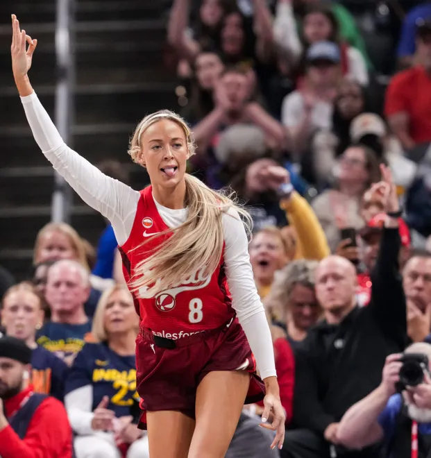 Indiana Fever guard Sophie Cunningham (8) celebrates a 3-pointer on Saturday, May 9, 2026, during the first half of the Fever's season opener game at Gainbridge Fieldhouse in Indianapolis.