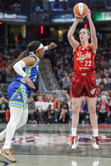 INDIANAPOLIS, INDIANA - MAY 9: Caitlin Clark #22 of the Indiana Fever shoots the ball against Arike Ogunbowale #24 of the Dallas Wings during the first half at Gainbridge Fieldhouse on May 9, 2026, in Indianapolis, Indiana. NOTE TO USER: User expressly acknowledges and agrees that, by downloading and or using this photograph, User is consenting to the terms and conditions of the Getty Images License Agreement. (Photo by Michael Hickey/Getty Images)