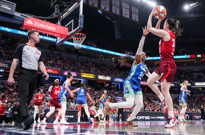 Indiana Fever guard Caitlin Clark (22) goes up for a basket against Dallas Wings guard Arike Ogunbowale (24) on Saturday, May 9, 2026, during the second half of the Fever's season opener game at Gainbridge Fieldhouse in Indianapolis. The Dallas Wings defeated the Indiana Fever, 107-104.