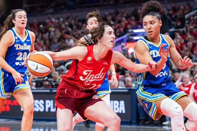 May 9, 2026; Indianapolis, Indiana, USA; Indiana Fever guard Caitlin Clark (22) dribbles the ball while Dallas Wings guard Azzi Fudd (35) defends in the first half at Gainbridge Fieldhouse. Mandatory Credit: Trevor Ruszkowski-Imagn Images