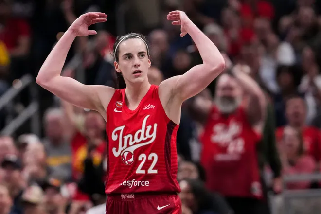 Indiana Fever guard Caitlin Clark (22) gets the crowd excited on Saturday, May 9, 2026, during the second half of the Fever's season opener game at Gainbridge Fieldhouse in Indianapolis. The Dallas Wings defeated the Indiana Fever, 107-104.
