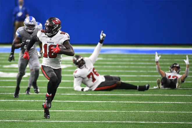 Dec 26, 2020; Detroit, Michigan, USA; Tampa Bay Buccaneers wide receiver Tyler Johnson (18) runs the ball against the Detroit Lions during the third quarter at Ford Field. Mandatory Credit: Tim Fuller-USA TODAY Sports