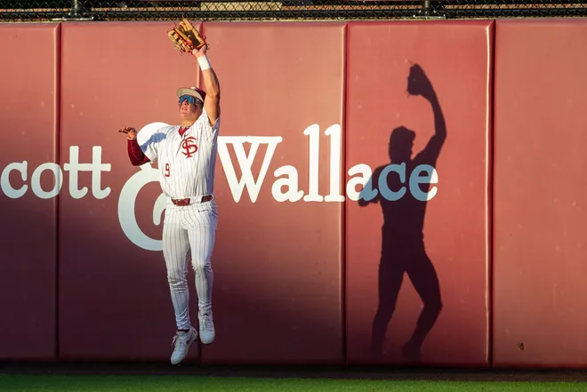 Florida State Seminoles outfielder John Stuetzer (9) catches a fly ball. The Florida State Seminoles hosted the Florida Gators at Dick Howser Stadium on Tuesday, April 7, 2026.