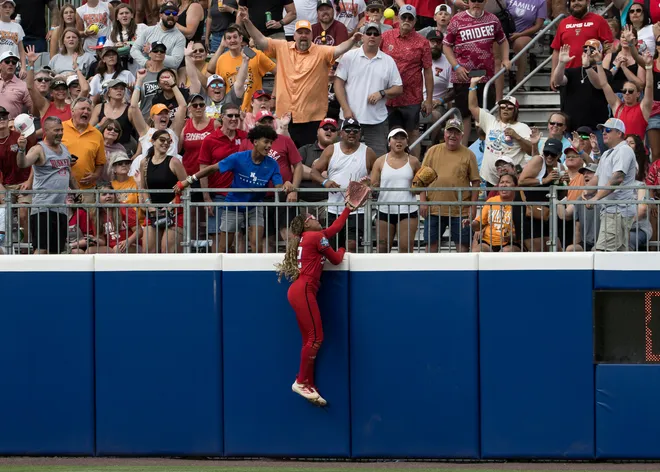 May 30, 2026; Texas Tech Red Raiders outfielder Mihyia Davis (42) makes an attempt to catch the walk-off home run ball by Tennessee Lady Volunteers infielder Emma Clarke (not pictured) to end the game during the NCAA Women’s College World Series at Devon Park.