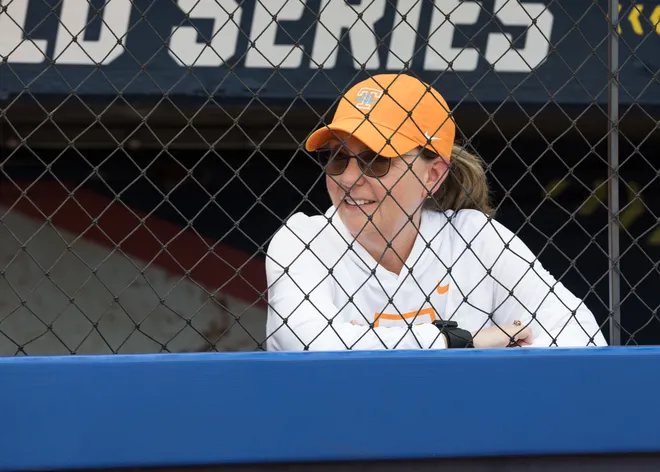 May 30, 2026; Oklahoma City, OK, USA; Tennessee Lady Volunteers head coach Karen Weekly looks on from the dugout during warmups before the game against the Texas Tech Red Raiders during the NCAA Women’s College World Series at Devon Park.