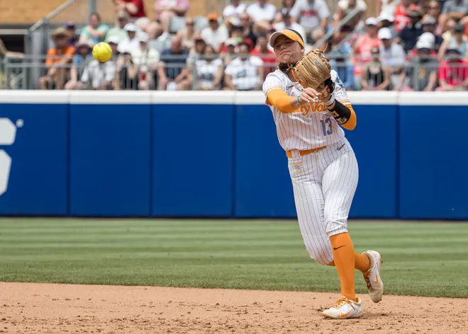 May 30, 2026; Oklahoma City, OK, USA; Tennessee Lady Volunteers infielder Emma Clarke (13) throws to first base for an out in the second inning against the Texas Tech Red Raiders during the NCAA Women’s College World Series at Devon Park.
