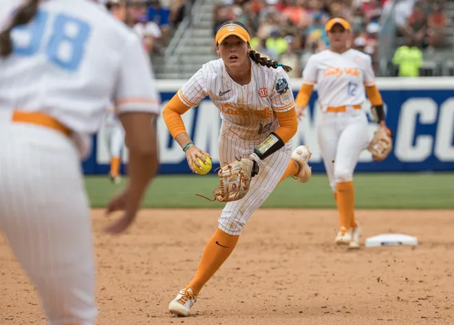 May 30, 2026; Tennessee Lady Volunteers infielder Emma Clarke (13) fields the ball and looks up to first and makes the throw for an out in the fourth inning against the Tennessee Lady Volunteers during the NCAA Women’s College World Series at Devon Park.