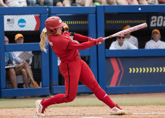 May 30, 2026; Oklahoma City, OK, USA; Texas Tech Red Raiders second baseman Mia Williams (1) hits a double in the sixth inning against the Tennessee Lady Volunteers during the NCAA WomenÕs College World Series at Devon Park.